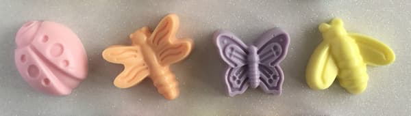pink ladybug, orange dragonfly, purple butterfly and yellow bee soap bars