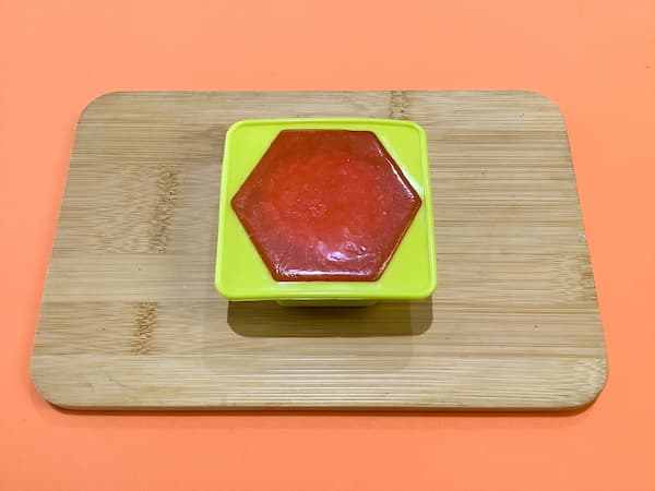 a hexagonal soap mould filled to the top with orange soap