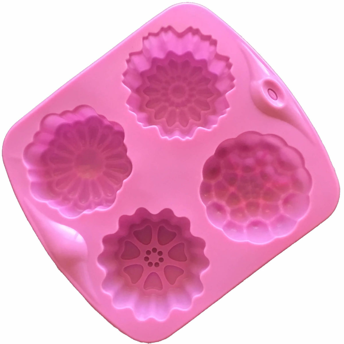 back of pink four cavity silicone mould with four individual floral designs