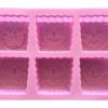 back of pink six cavity silicone mould with Sponge Bob head-shaped cavities each with an individual facial expression showing mould cavity details
