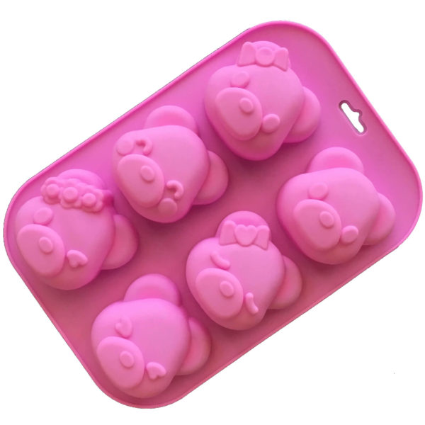 pink six cavity silicone mould with teddy bear head-shaped cavities each with an individual facial expression