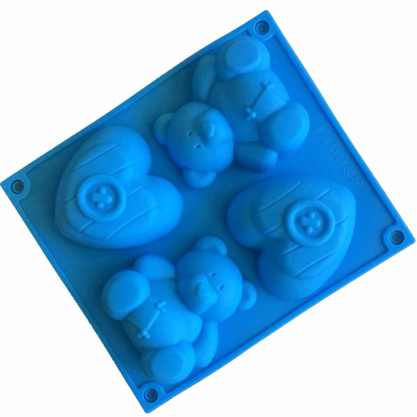 large blue silicone mould with four cavites - two each of toy teddy bear and a heart with a button in the middle