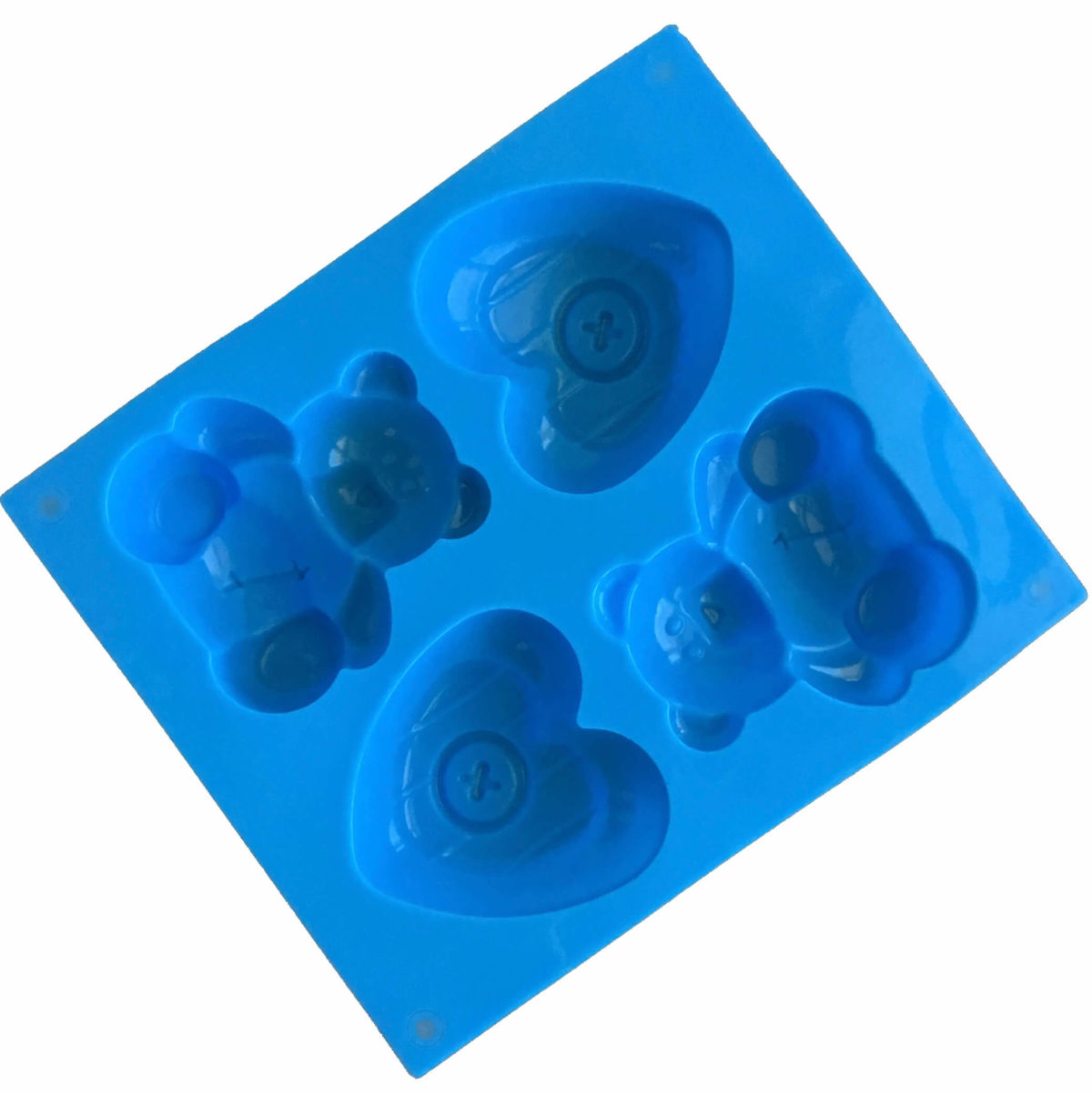 back of large blue silicone mould with four cavites - two each of toy teddy bear and a heart with a button in the middle