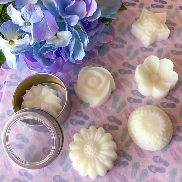 floral lotion bars laid out with flowers