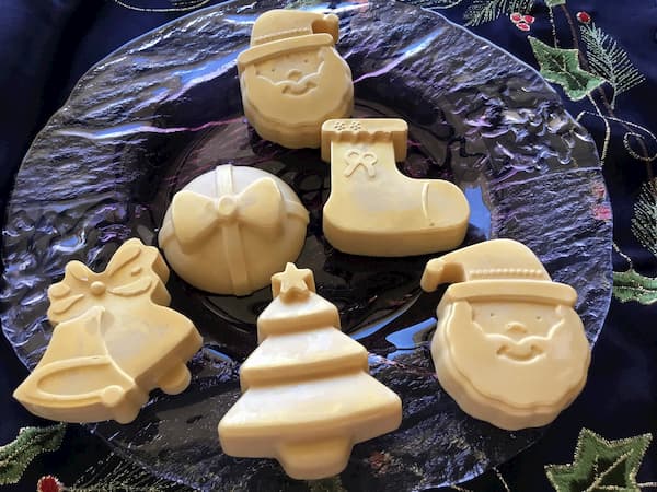 gold lotion bars in the shape of santa, xmas tree, stocking, bells and bauble